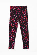 Black leggings with pink and red dot pattern on a white background