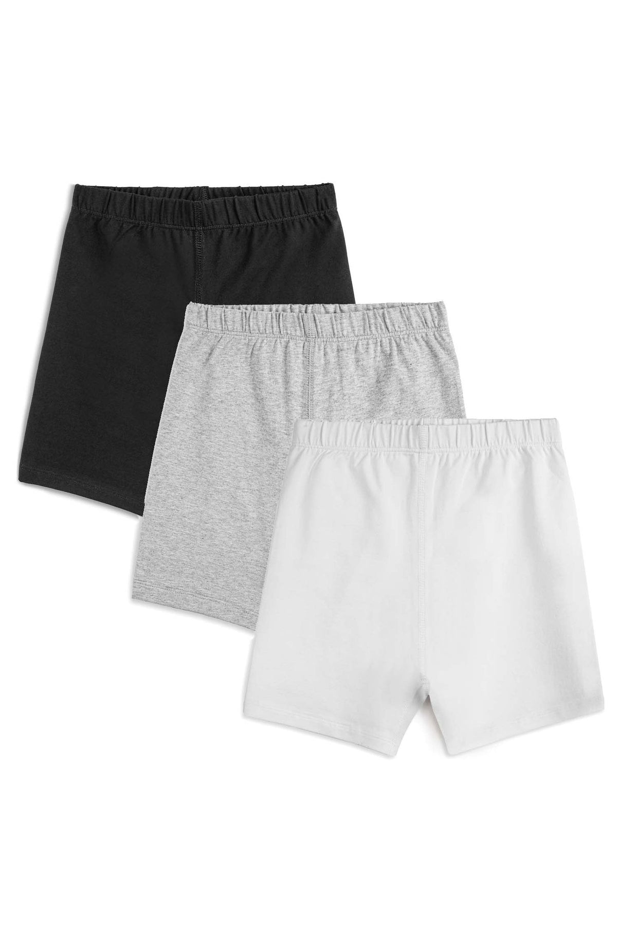 Three pairs of girls' biker shorts in black, gray and white stacked together on a white background.
